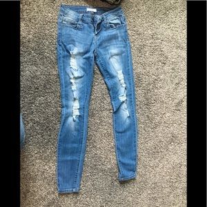 Distressed denim jeans